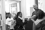 Tony Hobson Sr. greets students on the first day of the newly opened SEI Academy in North Portland.