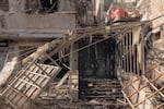 A residential building is significantly damaged by an Israeli airstrike.
