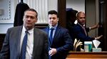 Kyle Rittenhouse, center, enters the courtroom with his attorneys Mark Richards, left, and Corey Chirafisi.