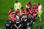 Egypt head coach Hossam Hassan talks to his players during the World Cup round of 16 soccer match between Argentina and Egypt in Atlanta, Tuesday, July 7, 2026.