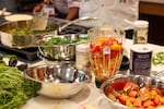 Fresh ingredients, including tomatoes and greens, are spread out during a teaching kitchen class that took place during the Indigenous Food Summit at Portland State University on Sept. 9, 2026.