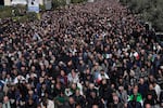 Iranians attend Friday prayers in the courtyard of the Imam Khomeini Grand mosque in Tehran, Iran, Friday, March 6, 2026.