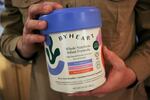 FILE - Stephen Dexter holds a container of ByHeart baby formula, which was recently recalled by ByHeart, in Flagstaff, Ariz., on Wednesday, Nov. 12, 2025.