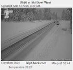 In this image captured by an Oregon Dept. of Transportation camera just after 8:30 a.m. on March 13, snow has fallen along U.S. 26. near Ski Bowl