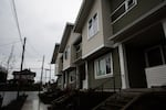 A new triplex is pictured on the corner of Northeast Sixth Avenue and Northeast Ainsworth Street Friday, Feb. 1, 2019, in Portland, Ore. A bill in the state Legislature would change single-family zoning rules to allow more buildings like this in cities looking to grow more dense.