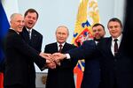 From left: Moscow-appointed head of Kherson region Vladimir Saldo and head of Zaporizhzhia region Yevgeny Balitsky, Russian President Vladimir Putin, Denis Pushilin, leader of self-proclaimed Donetsk People's Republic and Leonid Pasechnik, leader of self-proclaimed Luhansk People's Republic, at a ceremony at the Kremlin on Friday to sign treaties for the four regions of Ukraine to join Russia.