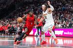 Denver Nuggets forward Aaron Gordon (32) defends against Portland Trail Blazers forward Jerami Grant (9) during the second half of an NBA Cup basketball game Friday, Oct. 31, 2025, in Portland, Ore.