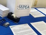 Members of Washington Public Employees Association did not receive a pay hike in July as other state workers did because their contract did not get funded in the budget. They are now voting on new agreements that would get them pay hikes.