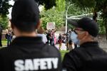 An anti-mask protester talks into a megaphone towards district resource officers with Vancouver Public Schools on Friday, Sept. 10, 2021. The district recently received an injunction against "disruptive" protests from a Clark County judge.