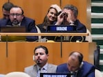 U.N. Ambassador from Ukraine Sergiy Kyslytsya uses binoculars in the U.N. General Assembly before a vote condemning Russia's move to illegally annex parts of Ukraine.