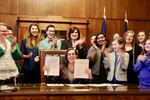 Gov. Kate Brown signs a bill making it easier to change gender identity on government documents at the Oregon Capitol.