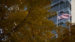 The American flag flies outside the Mark O. Hatfield United States Courthouse in Portland, Ore., Nov. 4, 2019.