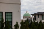 Plano EPIC mosque is seen behind a row of homes in Plano. Many muslims like to live near their mosque to facilitate practicing their faith daily.