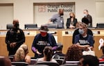 Women wearing "Moms for Liberty" shirts attend the Orange County Public School Board Meeting in Orlando, Fla., on Oct. 26, 2021.