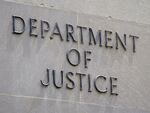 A sign outside the Robert F. Kennedy Department of Justice building is seen in Washington, D.C., on May 4, 2021.