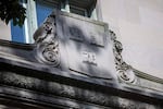 The Harvard crest on the facade of Langdell Hall at the Harvard Law School. (Jesse Costa/WBUR)