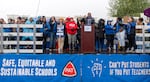 Despite the pouring rain, hundreds of people attended Portland Association of Teachers rally held at Roosevelt High School in Portland, Ore., Nov. 1, 2023. 