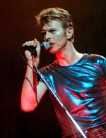 FILE - David Bowie performs during a concert in Hartford, Conn., on Sept. 14, 1995. The extensive catalog of David Bowie, stretching from the late 1960s to just before his death in 2016, has been sold to Warner Chappell Music. More than 400 songs, among them “Space Oddity,” “Ziggy Stardust," and “Let’s Dance" are included.