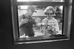 Former President Jimmy Carter and former first Lady Rosalynn Carter work at a Habitat for Humanity site in Atlanta, building houses for working poor people.