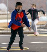 kids running across asphalt