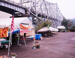 Beneath the Bridge of the Gods, the Cascade Locks farmer's market sits empty on Monday, Sept. 4, 2017, as the Eagle Creek Fire threatens the community.