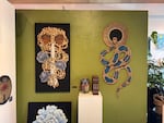 "Black Infinity House" is an art exhibit on display at Columbia Center for the Arts in Hood River until March 29, 2026. The exhibit, curated by August Oaks, features more than 30 Black artists in Oregon, including DeLoné Osby, who contributed multiple works shown here on Feb. 10, 2026. Osby uses pyrography, a technique involving fire to burn designs and illustrations onto canvases painted with striking images of skulls, hair, flowers and snakes.