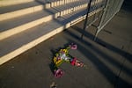 Flowers arranged in the shape of a uterus by Krissy Shields are seen near the steps of the Supreme Court on Friday, April 21, 2023, in Washington after the court decided to preserve women's access to a drug used in the most common method of abortion.