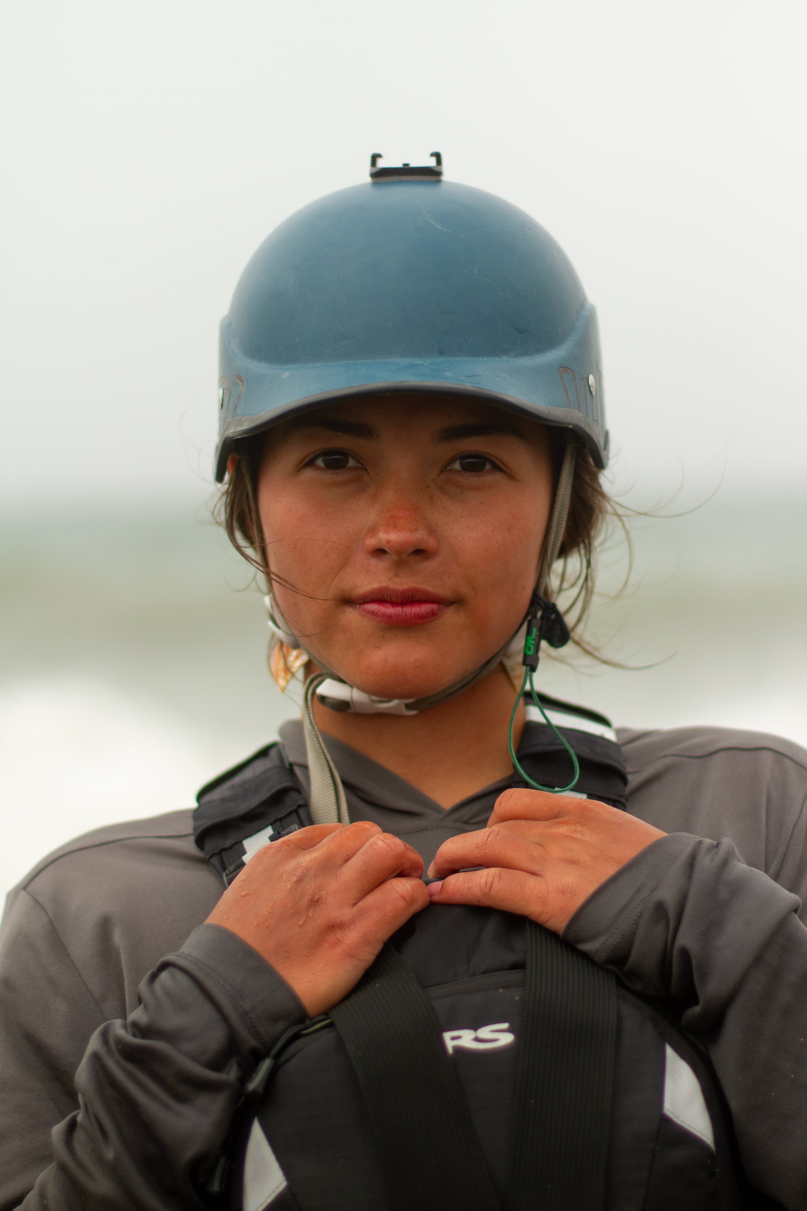 20-year-old Isqotsxoyan Scott, Hupa, poses for her portrait at the mouth of the Klamath River on July 11, 2025. Scott says she has been preparing for this moment for four years.