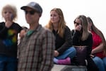 Deborah Grimshaw, right, wipes away tears during the Portland Fire & Rescue ceremony on Sept. 11, 2026, commemorating the 25th anniversary of the Sept. 11 attacks. “It feels like it just happened yesterday, just the emotion of it,” said Grimshaw, who was six months pregnant with her daughter at the time, Sarah Grimshaw, center. “I just remember feeling very scared. Not just scared, like terrified, just terrified of what this meant for our future and for my kids.”