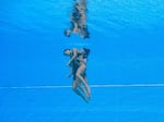 Team USA swimmer Anita Alvarez is brought to the surface by coach Andrea Fuentes. "Our sport is no different than others," Fuentes said, "just in a pool, we push through limits and sometimes we find them."