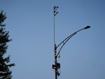 ShotSpotter equipment overlooks the intersection of South Stony Island Avenue and East 63rd Street in Chicago on Aug. 10, 2021. The city will not renew its contract for the gunfire detection equipment.