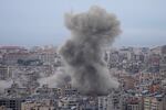 Smoke rises between buildings hit in a Israeli airstrike in Dahiyeh, in the southern suburb of Beirut, Lebanon, Sunday, Nov. 17, 2024.