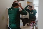 Sabrina Robinson of the Boston Hunters fixes her hair in her hotel room before a social outing with fellow players in the Women's Pro Baseball League. Springfield, IL, July 30, 2026.