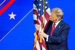 Before he was elected to a second term, former President Donald Trump hugged and kissed the U.S. flag as he spoke at the Conservative Political Action Conference at National Harbor, in Oxon Hill, Md., in 2024.