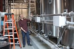 Ryan Reid with Deschutes Brewery shows off one of the brew kettles at the flagship brewery in Bend. 