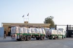 A truck enters the Egyptian gate of the Rafah crossing, heading for inspection by Israeli authorities before entering the Gaza Strip.