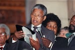 On Feb. 11, 1990, in Cape Town, South Africa, Mandela delivers his first public speech since his release from person. Behind him is his then-wife, Winnie Madikizela-Mandela.