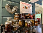 Jars of pickles, jam and other preserves line the shelves of Heather Arndt Anderson's pantry on September 12, 2024. Anderson is the food writer and culinary historian behind OPB's Superabundant newsletter.