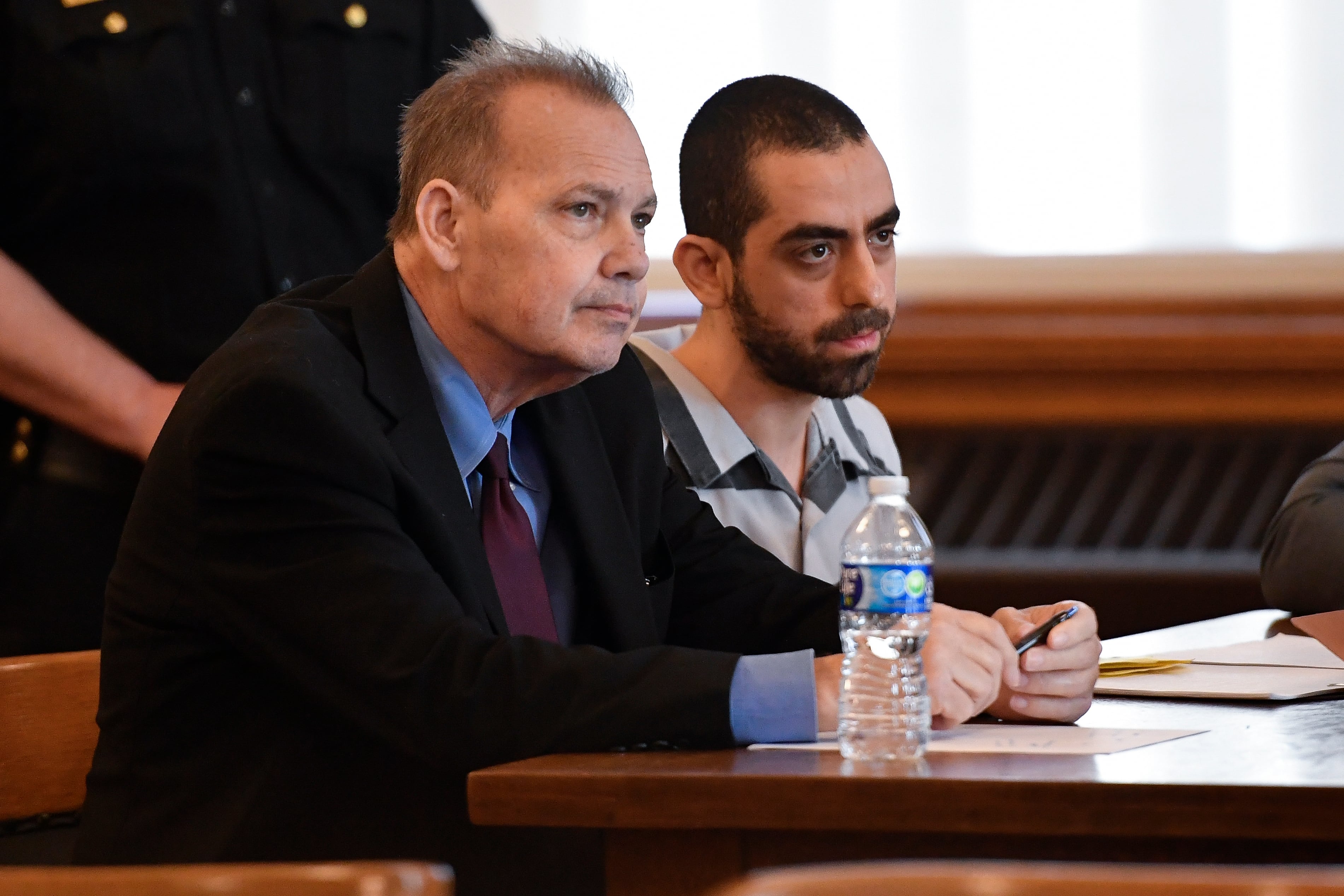 Hadi Matar (right) and public defender Nathaniel Barone listen to Chautauqua County Judge David Foley's sentence in Chautauqua County court in Mayville, N.Y., on Friday.