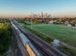 A freight train is seen traveling through Houston in 2022. The U.S. freight rail network runs on almost 140,000 route miles, according to the Federal Railroad Administration. And U.S. railroads typically transport more than 2 million carloads of hazardous materials each year, according to the Association of American Railroads.