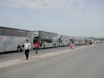 Buses line up to take Ukrainians back over the border and home.