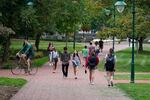 Students walk to and from classes on the Indiana University campus in Bloomington, Ind., in 2021.