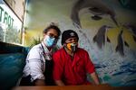 Graciela Flores Rodriguez and her husband, Felipe, pose inside their business, Vera Cruz Bakery. Businesses in Vancouver's international district are struggling in the pandemic.