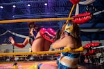 Athena Estrada drop-kicks Sakura during a lucha libra extravaganza in Aurora, Colorado. July 24, 2022.