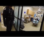 In this bodycam footage released by the Milwaukie Police Department, 26-year-old Jean Descamps can be seen in a hospital bed at the Providence Hospital emergency room in Milwaukie, Oregon.