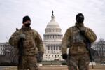 Members of the national guard patrol the area outside of the U.S. Capitol during the impeachment trial of former President Donald Trump at the Capitol in Washington, Wednesday, Feb. 10, 2021.