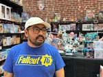 Tommy Ly poses inside his gift store Stumptown Otaku in downtown Portland, Ore., on Sept. 16, 2024.