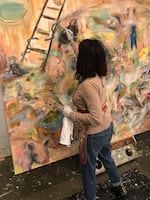 Renée Zangara painting in her studio near St. Johns.