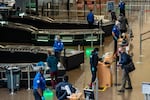 Travelers pass through security screening at Seattle-Tacoma International Airport on Nov. 29, 2020.