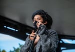 Artist Karla Mi Lugo speaks at the violin vigil for Elijah McClain at Peninsula Park in Portland, Ore., Friday, July 3, 2020. Lugo has been helping organize violin vigils for McClain, including the inaugural event in Aurora, Colorado.